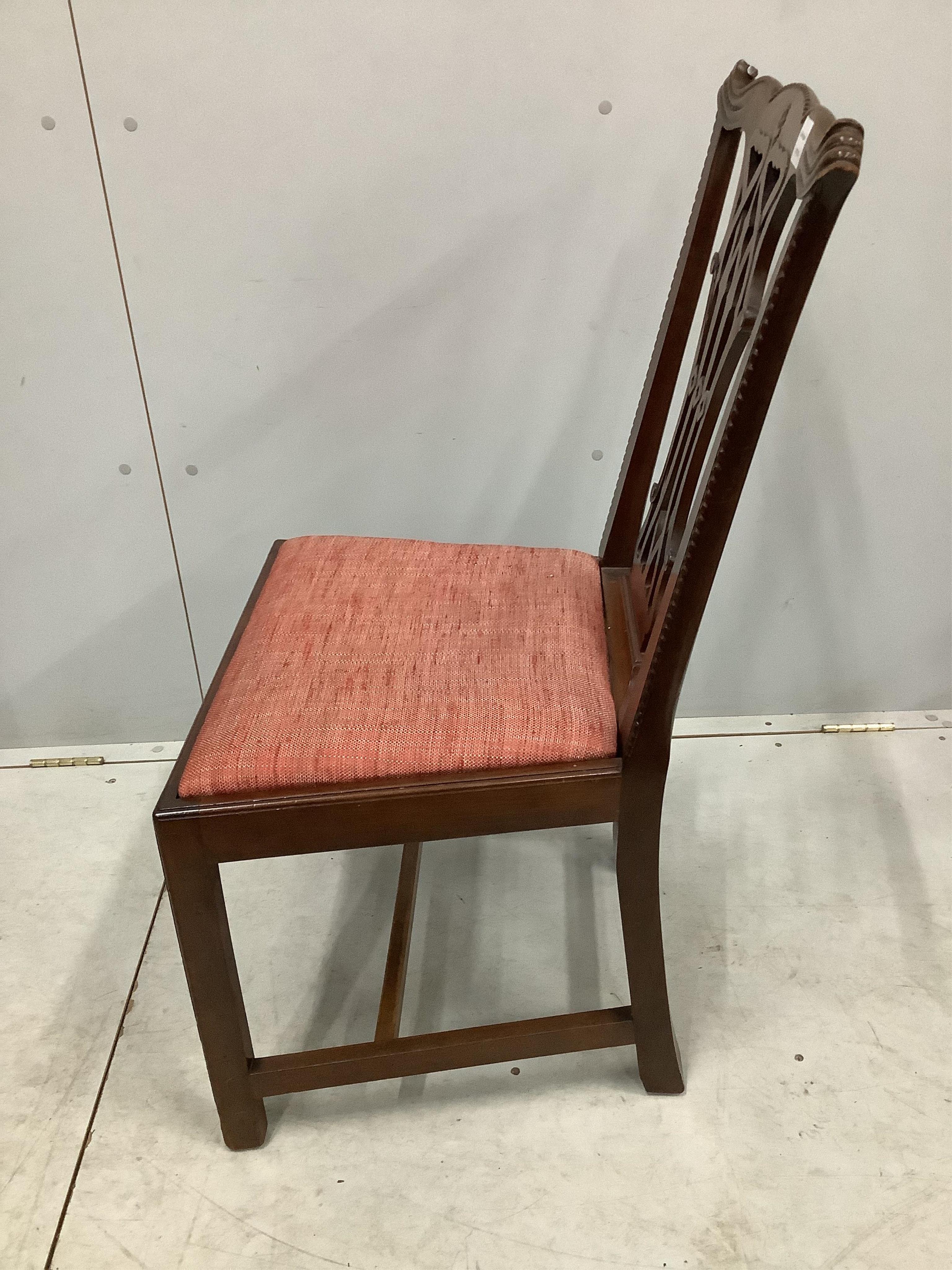 A set of six George III style mahogany Chippendale design dining chairs, with pierced splats, over drop-in seats and H stretchers. Condition - fair to good